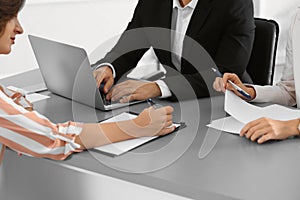 Human resources commission conducting job interview with applicant in office