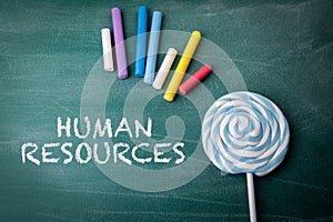 Human Resources. Employment Issues Concept. Text on a green chalkboard background