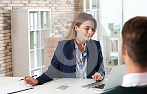 Human resources manager conducting job interview with applicant