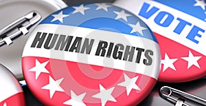 Human rights and elections in the USA, pictured as pin-back buttons with American flag, to symbolize that Human rights can be an