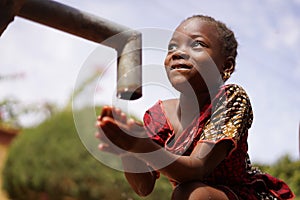 Human Rights Issues, African Black Ethnicity Girl Woman Drinks Fresh Clean Water from Tap