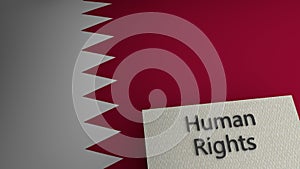 Human rights text representation above the flag of Qatar. 3d render. photo