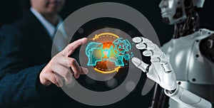 Human and robot hand as a symbol of connection between people and AI technology with chatbot communicate.Robot application,