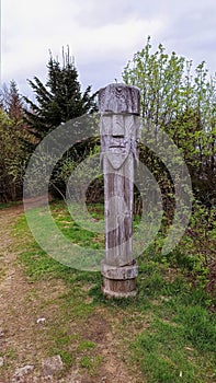 A human shape engraved on a wooden block or log in the view point of Lubon Wielki located in South Poland mountains, Europe