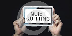 Human showing Quiet Quitting message. Business concept