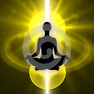 Human silhouette in yoga pose and meditation with light
