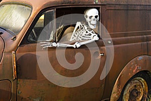 Human skeleton car driver