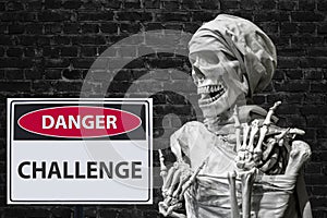 Human skeleton and sign danger challange