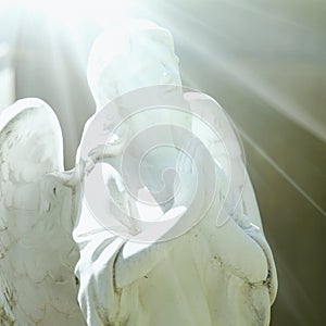 Human soul with wings in the rays of light. Symbolic photography. Angel, Christianity, religion, death concept