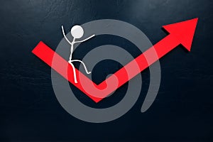 Human stick figure sliding on a red arrow pointing upward. Economy bounce back, rebound and recovery concept.