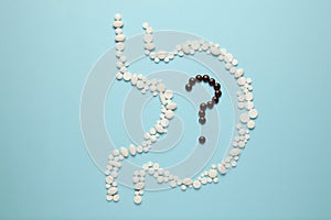 Human stomach from tablets, question mark in the stomach. Healthy nutrition, metabolism in the body