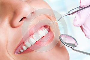 Human teeth with hatchet and mouth mirror