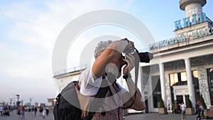 Human Traveler Blogger Makes Shots For His Blog.