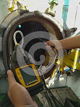 Human using the gas detector for detect combustible gas