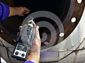 Human using the gas detector for detect combustible gas