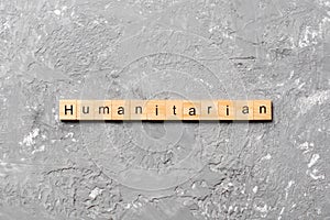 Humanitarian word written on wood block. humanitarian text on table, concept