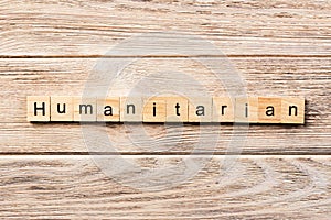 Humanitarian word written on wood block. humanitarian text on table, concept