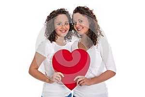 Humanity or friendship concept: isolated real twins with a red h