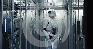 Humanoid robot checking servers in a data center