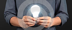 Humans hold light bulbs in hand innovative technology and creativity