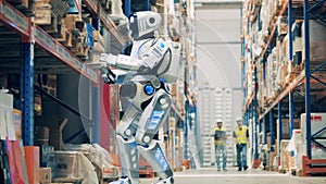 Humans and robot working together at warehouse