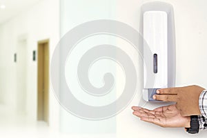 Humans using hand sanitizer