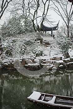 Humble Administrator`s Garden pond in snow, ancient suzhou, china