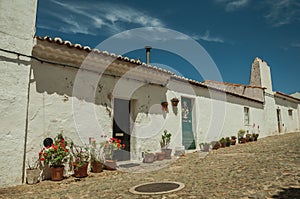 Humble house with flower pots at Evoramonte