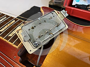 Humbucking pick up of electric guitar that is removed inside the guitar body, in case it is repaired, can be used as a preview in