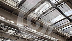Humidification system and indoor climate control. Spray nozzles that are glued to the roof of the building spray water
