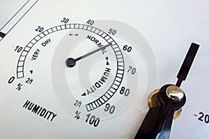 Humidity measurements. Needle instruments hygrometer closeup. Weather conditions and meteorological parameters. Face of analog