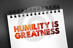 Humility Is Greatness text on notepad, concept background