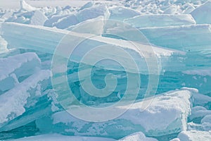 Hummocks on the lake. Ice in sunny day on the Kapchagai reservoir in Kazakhstan