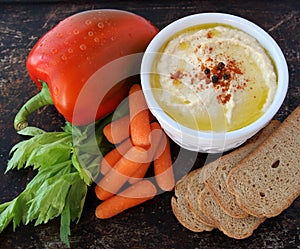 Hummus with crackers and veggies