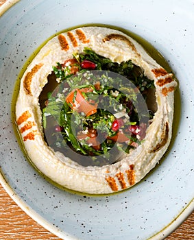 Hummus is a dip, spread, mashed chickpeas blended with tahini, lemon juice, and garlic