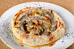 Hummus is a dip, spread, or savory dish made from cooked, mashed chickpeas