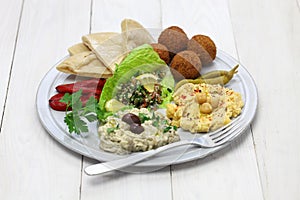 Hummus, falafel, baba ghanoush, tabbouleh photo