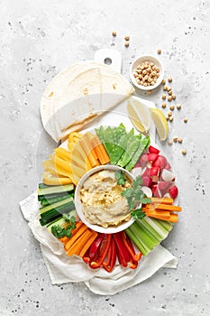 Hummus with fresh vegetables, healthy vegetarian food concept