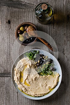 Hummus with olives and herbs