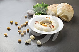 Hummus plate with bread, lebanese cuisine of Hommos