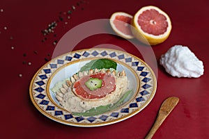 Hummus with sesame and pumpkin seeds and pomegranate vinaigrette photo