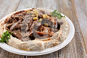 hummus topped with beef shawarma