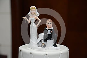 Humorous Ball and Chain Wedding Cake Topper Close-up