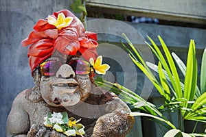 Humorous face portrait of old traditional Balinese temple guard