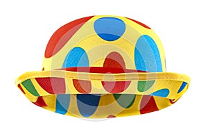 Humorous headgear concept with floating clown bowler hat in red, blue, green and yellow colors  isolated on white background with
