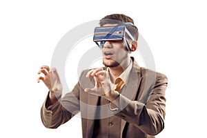 A humorous photo of modern technologies. Young guy with a phone attached to the head using a tape. Virtual reality gadget