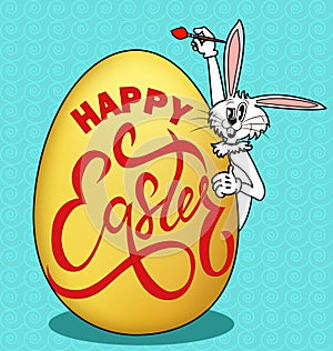 humorous picture on Easter. Rabbit paints an egg with a greeting