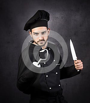 A humorous portrait of a pirate-style chef cooker in black.