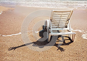 Humorous scene: cheerful invisible somebody with shadow on the sand