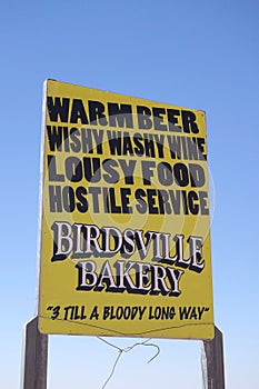 Humorous advertising sign for the Birdsville Bakery in Western Queensland, Australia photo